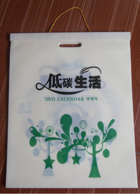 無(wú)紡布袋掛歷批發(fā)，無(wú)紡布掛歷訂做廠家